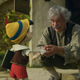 (from left) Pinocchio (voiced by Benjamin Evan Ainsworth), Tom Hanks as Geppetto, and Figaro in Disney’s live-action Pinocchio.